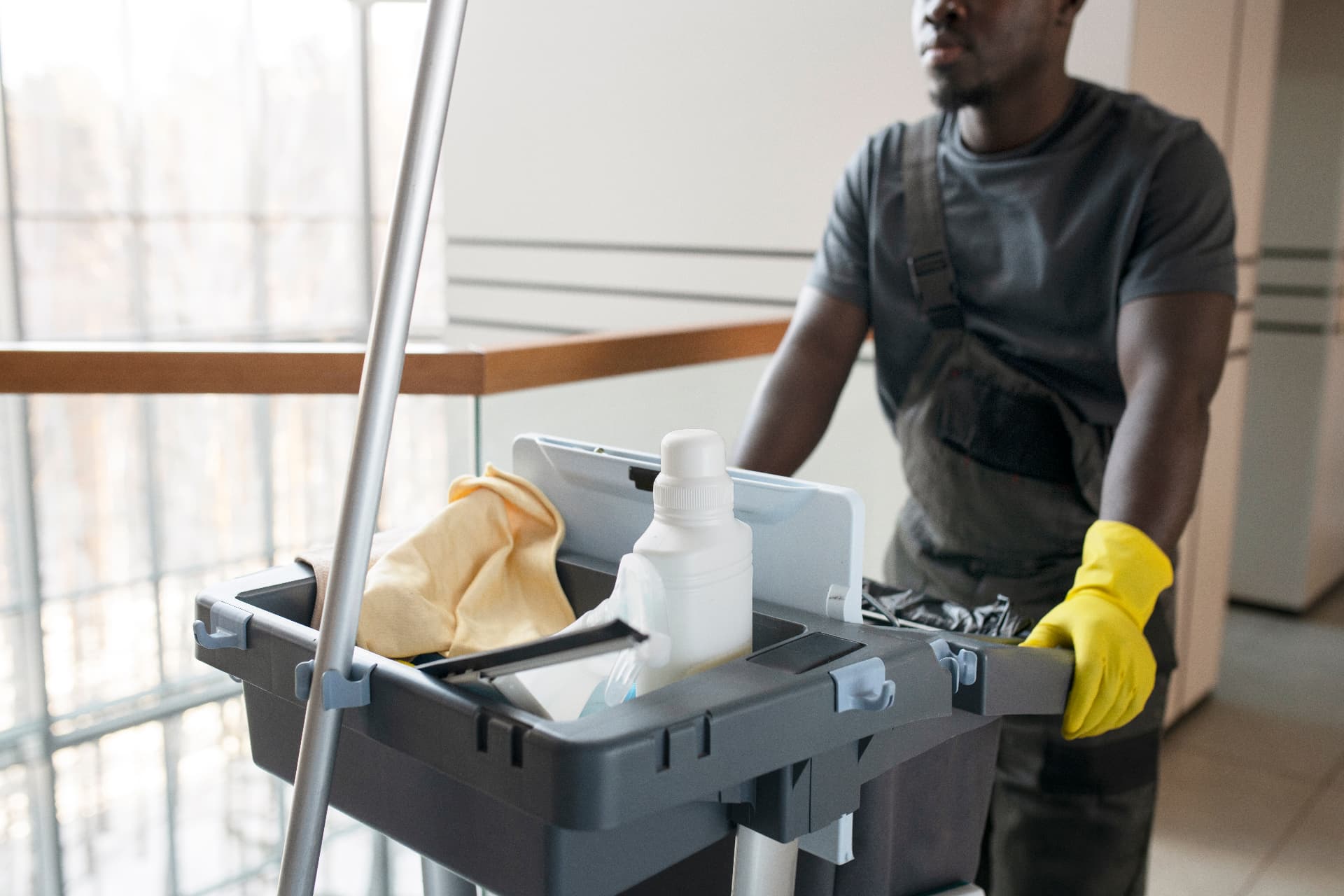 EBC cleaner moving a cleaning cart through a retail building